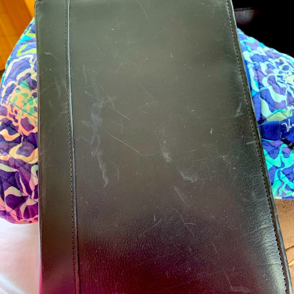 COACH genuine leather zippered planner.